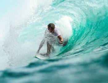 Surfer riding wave during competition