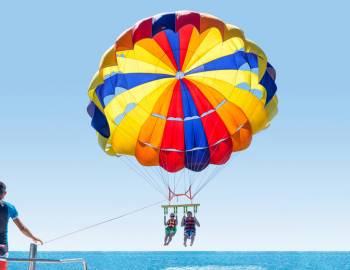 A couple parasails in Surfside Beach