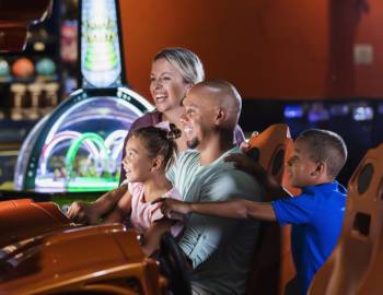A family playing at an arcade