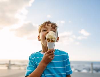 A boy enjoys an ice cream cone