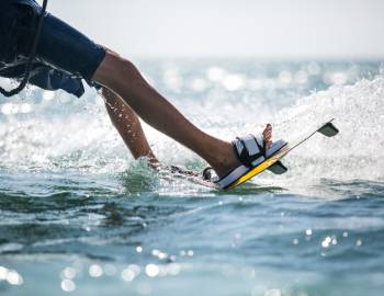 A person enjoys water-sports at the Shark Wake Park