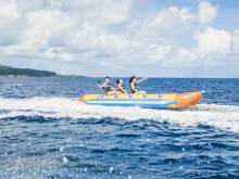 A family enjoys time on a banana boat