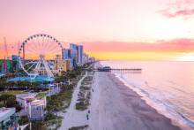 Aerial view of Myrtle Beach SkyWheel and Boardwalk at sunset