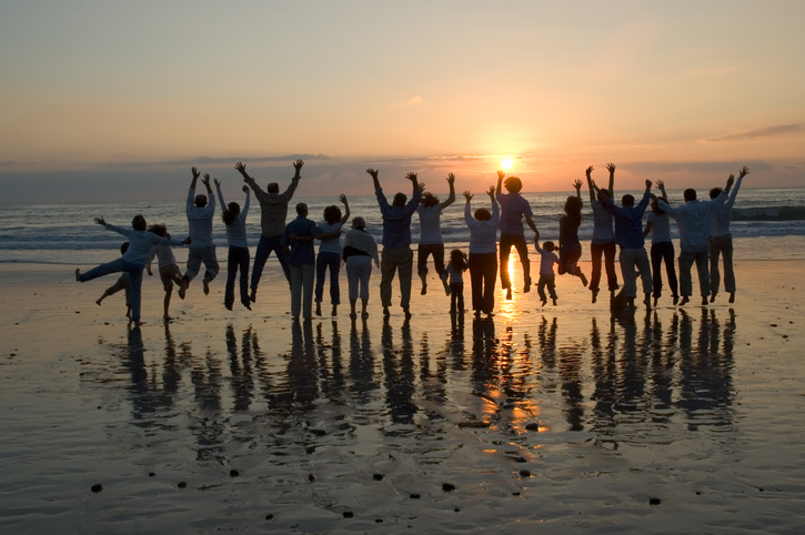 A family enjoying sunset at the beach