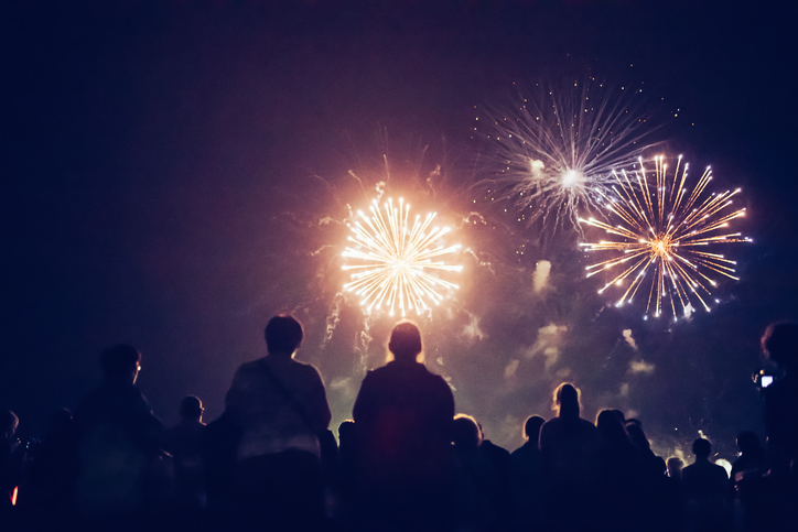 A group of people watching fireworks on the 4th of July