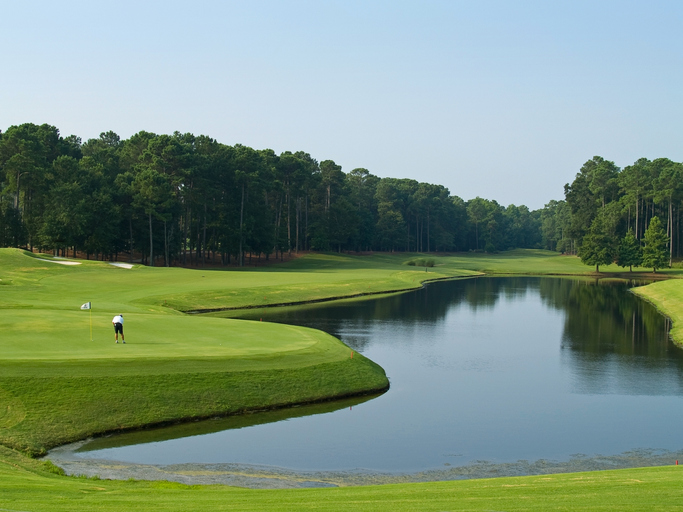 A golfer stands on a Myrtle Beach golf course