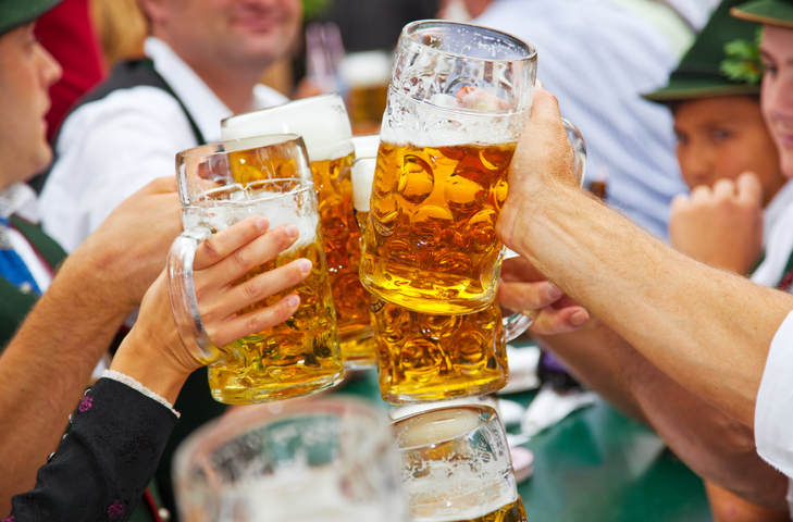 Friends cheers beers at Oktoberfest