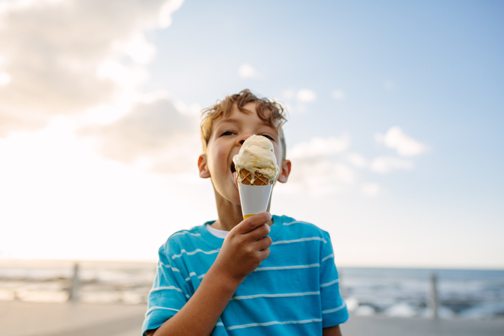 A boy enjoys an ice cream cone