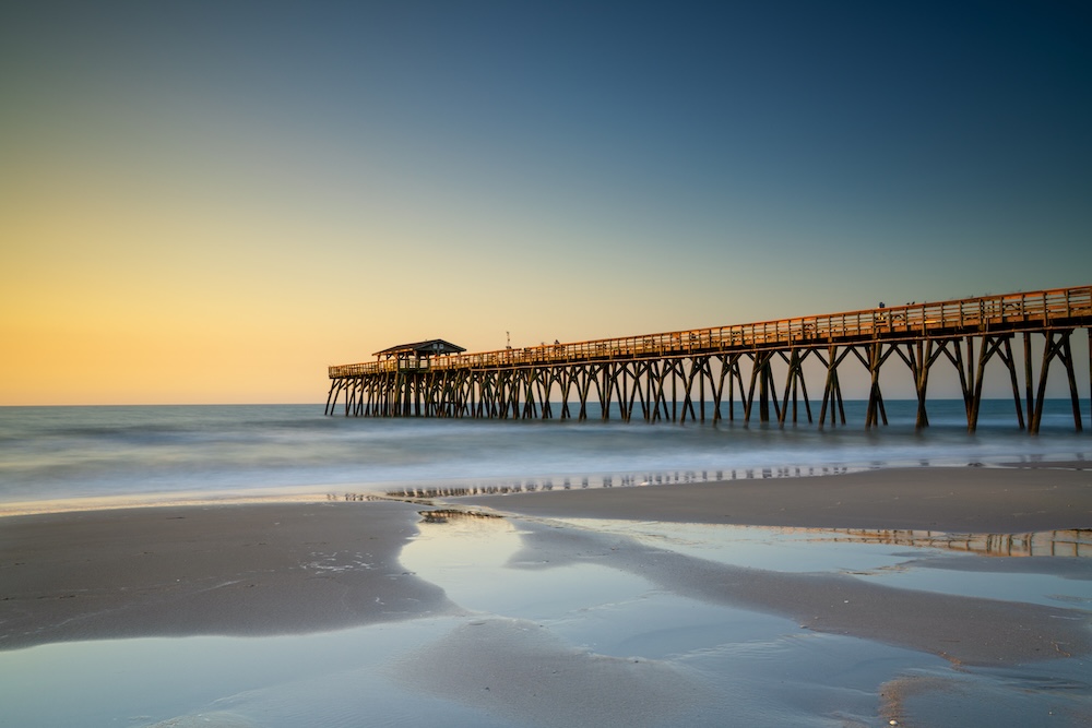 Wooden pier and ocean at Myrtle Beach State Park
