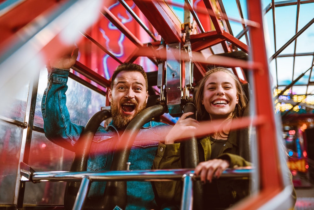 Couple riding a rollercoaster
