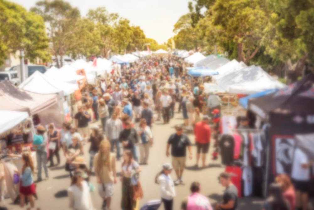Aerial photo of vendors and attendees at a street festival